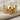 Spread Winged Skull Ring, gold vermeil, front view on linen fabric