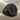 Aquarius Skull Ring in black rhodium, angled product view on fabric
