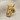 Göbeklitepe pillar lapel pin in gold vermeil, front view on fabric