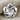 Plumeria Flower Pendant in polished silver, product photo on fabric