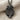 Tropical Palm Pendant, black rhodium, front product view on linen fabric