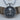 Jesus Christ Medallion Pendant, oxidized silver, front view on wood