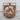 Coiled Tiger Pendant, rose gold, product photo on wood surface