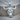 Charging Bull Pendant, polished silver, front view on wood base