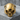 Angry Skull Ring, gold vermeil, front view on stone pedestal