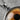 Evil Eye Honey Lens Pendant, oxidized silver, close-up of amber iris lens