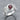 Tara Garnet Scroll Ring, polished silver, angled product photo