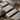 Staggered Terrace Pendant, oxidized silver, close-up of stepped tiers