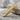 Stipple Panel Tie Clip Accessory, gold vermeil, product view on stone surface