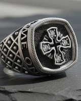 Side profile of silver signet ring displaying intricate quilted lattice texture and oxidized finish