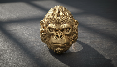Close-up front view of realistic gorilla head ring design displaying heavy metalwork and bold animal features