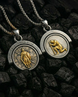 Comparison of gold and silver spinning knight pendants displayed on dark textured surface