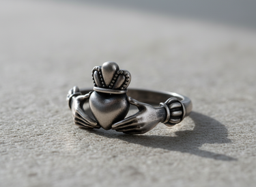 Oxidized 925 sterling silver Claddagh ring displaying vintage finish and intricate Celtic design details