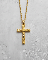 14K gold vermeil silver hammered cross pendant with rustic texture on grey background