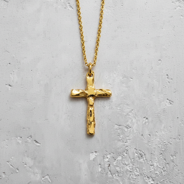 14K gold vermeil silver hammered cross pendant with rustic texture on grey background