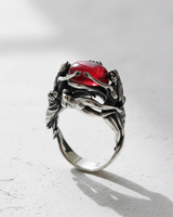 Side profile of handcrafted silver goddess ring showing detailed female figures and stone setting