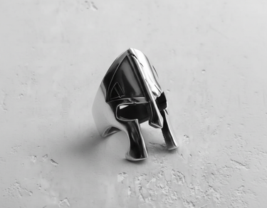 Side profile of handcrafted silver Spartan helmet ring showing polished finish and depth