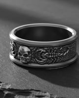 Side profile of the Silver Scorpion Skull Ring, detailing the textured scorpion body and oxidized finish on a slate background.