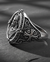 Profile view of 925 silver Christian ring displaying ornate scrollwork and thick band construction