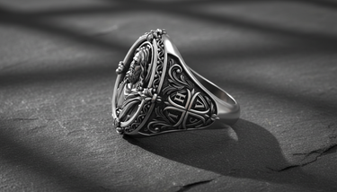 Profile view of 925 silver Christian ring displaying ornate scrollwork and thick band construction