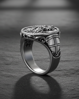 Angled view of silver signet ring with Saint George engraving and textured inner band design