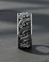 Front view of wide band sterling silver ring with detailed swirling ocean water design for nature lovers