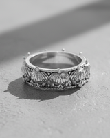 925 sterling silver skull pumpkin ring featuring a continuous band of carved jack-o-lantern skulls with beaded edges