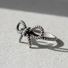 Handcrafted 925 sterling silver bow knot ring with twisted rope texture displayed on a neutral stone surface