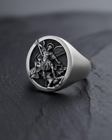 Oxidized 925 sterling silver St Michael ring with a detailed view of the archangel defeating Satan.