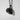 Pumpkin Leaf Pendant, black rhodium plated, angled view against a white wall