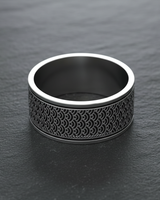 Close up of traditional geometric wave engravings on premium sterling silver wide band ring