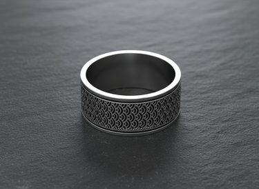 Close up of traditional geometric wave engravings on premium sterling silver wide band ring