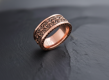 Side view of handcrafted band ring showing detailed relief work in rose gold finish