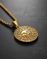 Gold vermeil Aztec skull pendant featuring intricate calendar details on black background