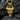 Close-up of horned dragon pendant resting on dark textured stone highlighting intricate scales and craftsmanship