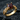 Close-up of the red gemstone promise ring displayed on a dark slate surface, highlighting the rich 14K gold vermeil finish.