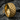 Close-up of premium Japanese wave ring in 925 sterling silver with gold finish resting on a rugged dark stone surface