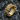 Macro view of the 925 silver Maltese cross skull ring resting on dark textured stone showing precise metalwork