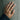 Botanical Leaf Ring worn on model hand against a concrete wall