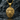 Detailed 925 sterling silver and gold vermeil eagle pendant resting on a dark textured stone background