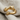 Hugging Arms Ring, gold vermeil, product view on linen fabric