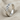 Diagonal Twist Ring, polished silver, angled view on fabric