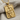 Queen of diamonds pendant, gold vermeil, angled view on fabric