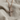 Pave Cross Pendant, rose gold, product photo on woven linen fabric
