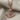 Anchor rope pendant, rose gold, product photo on fabric