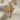 Winged Lion Sword Pendant, gold vermeil, front view on fabric