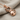 Bow Tie Cat Pendant, rose gold, angled view on linen