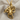 Close-up of the 3D sculpted octopus pendant resting on textured grey fabric highlighting the tentacles.