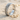 Grooved Band Ring, polished silver, product view on sand with seashells