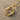Bird Letter O Pendant, gold vermeil, on sand and shell